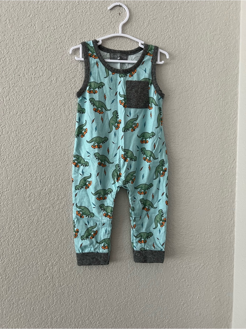 Vintage Light Blue Dinosaur Romper with Dark Gray Trim